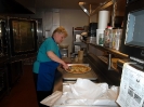 Mary Lynne prepares the pizzas